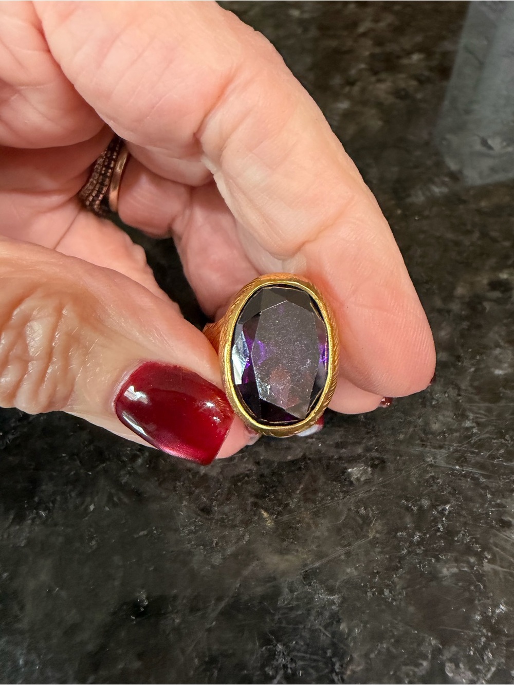 Gold-Tone Ring with Deep Purple Oval Stone